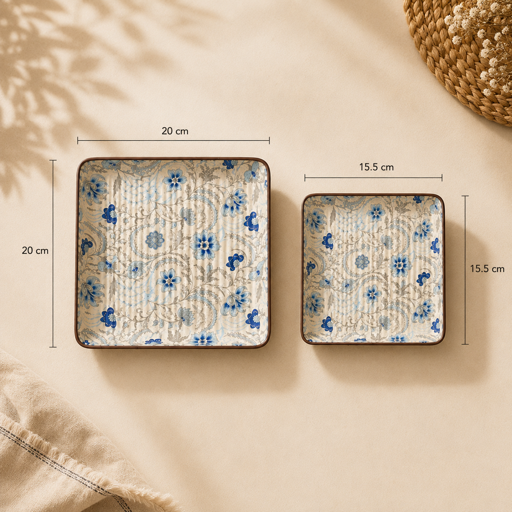 Two square decorative plates with a blue floral pattern on a cream background, shown with dimension labels indicating 20 cm by 20 cm and 15.5 cm by 15.