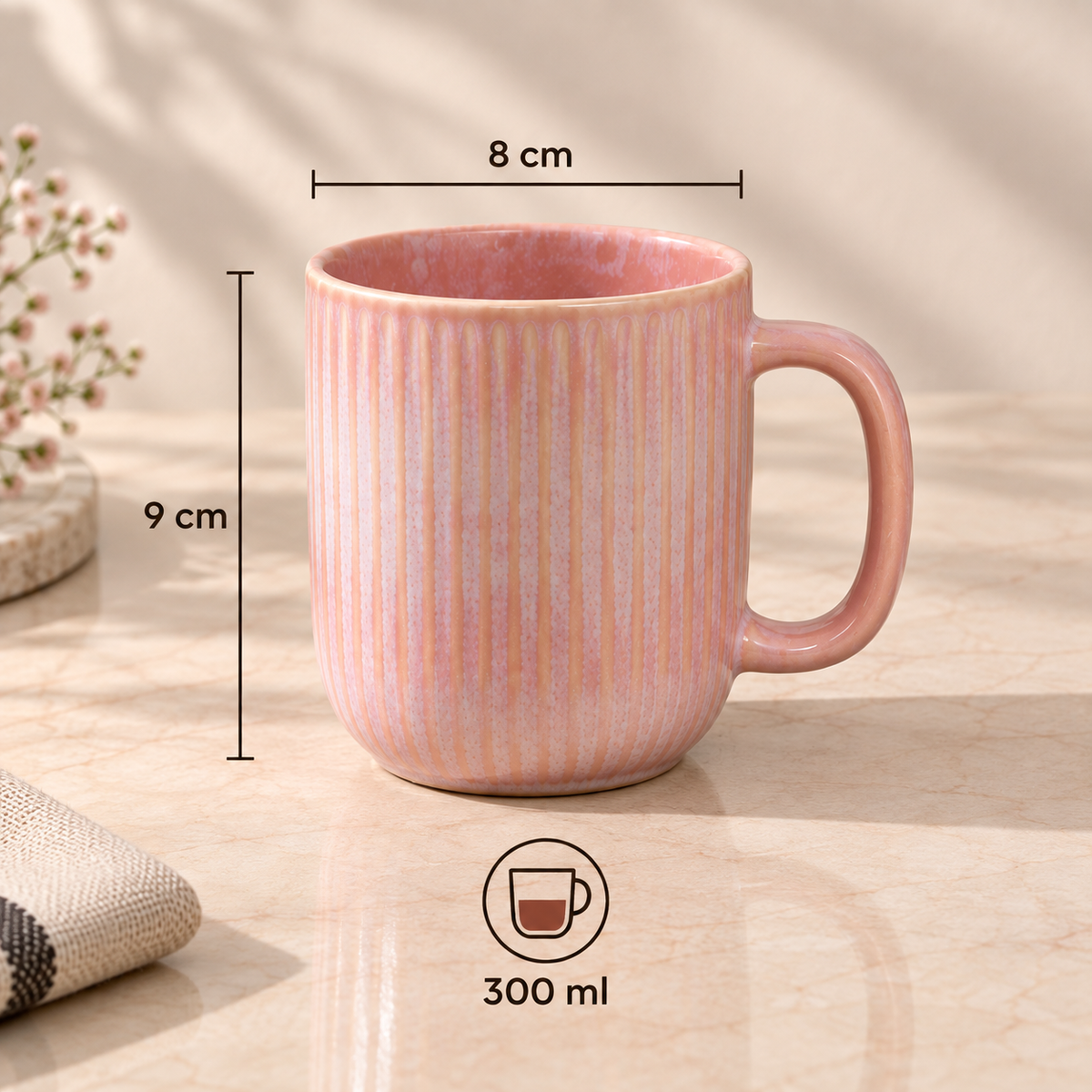 Cherry Blossom Mug in soft pink with textured finish with vertical ridges, shown on a light marble surface with dimension lines indicating 8 cm width, 9 cm height, and a 300 ml capacity.