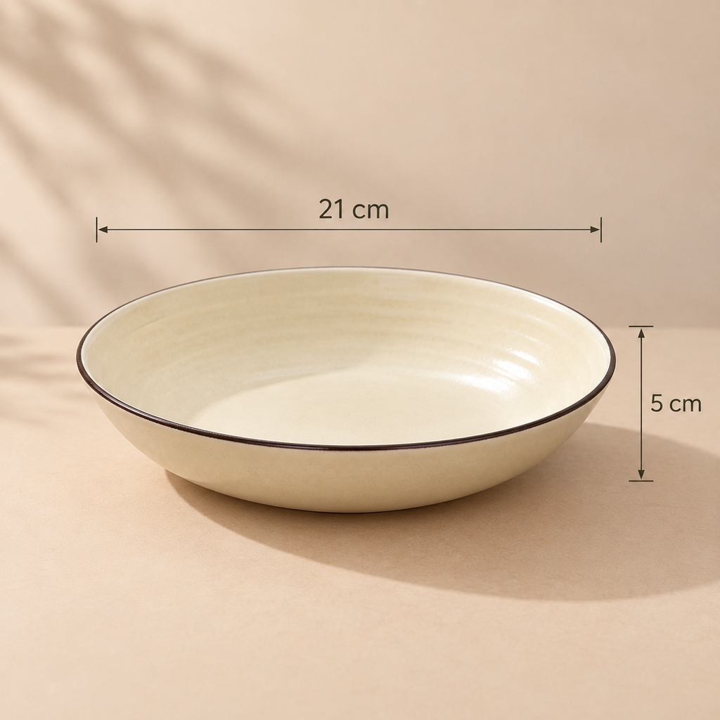Round ceramic Cove Serving Bowl with concentric detailing in a warm ivory finish.