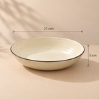 Round ceramic Cove Serving Bowl with concentric detailing in a warm ivory finish.