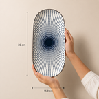 Oval ceramic Kyoto Serving Platter by Ozay Living featuring a Japanese-inspired indigo radial pattern.