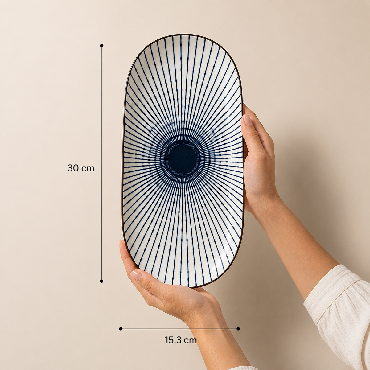 Oval ceramic Kyoto Serving Platter by Ozay Living featuring a Japanese-inspired indigo radial pattern.