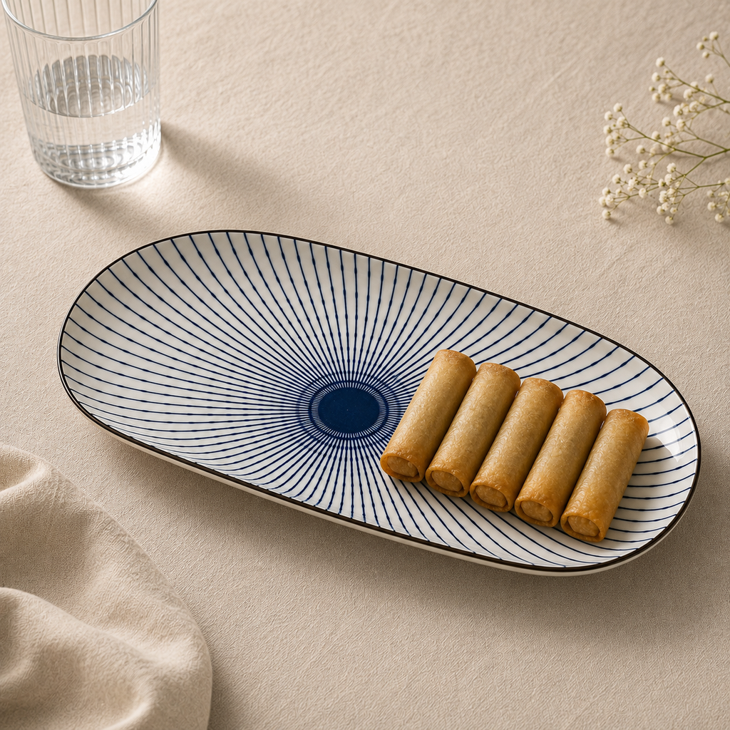 Oval ceramic Kyoto Serving Platter by Ozay Living featuring a Japanese-inspired indigo radial pattern.