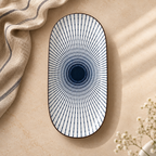 Oval ceramic Kyoto Serving Platter by Ozay Living featuring a Japanese-inspired indigo radial pattern.
