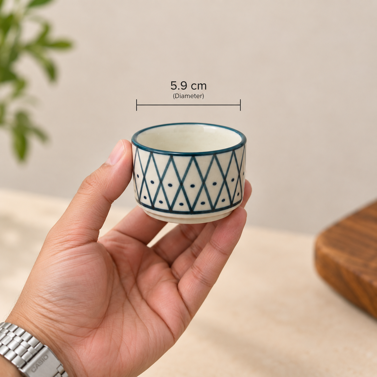 Ozay Living Lattice Dip Cup held in hand showing its 5.9 cm diameter and compact ceramic design