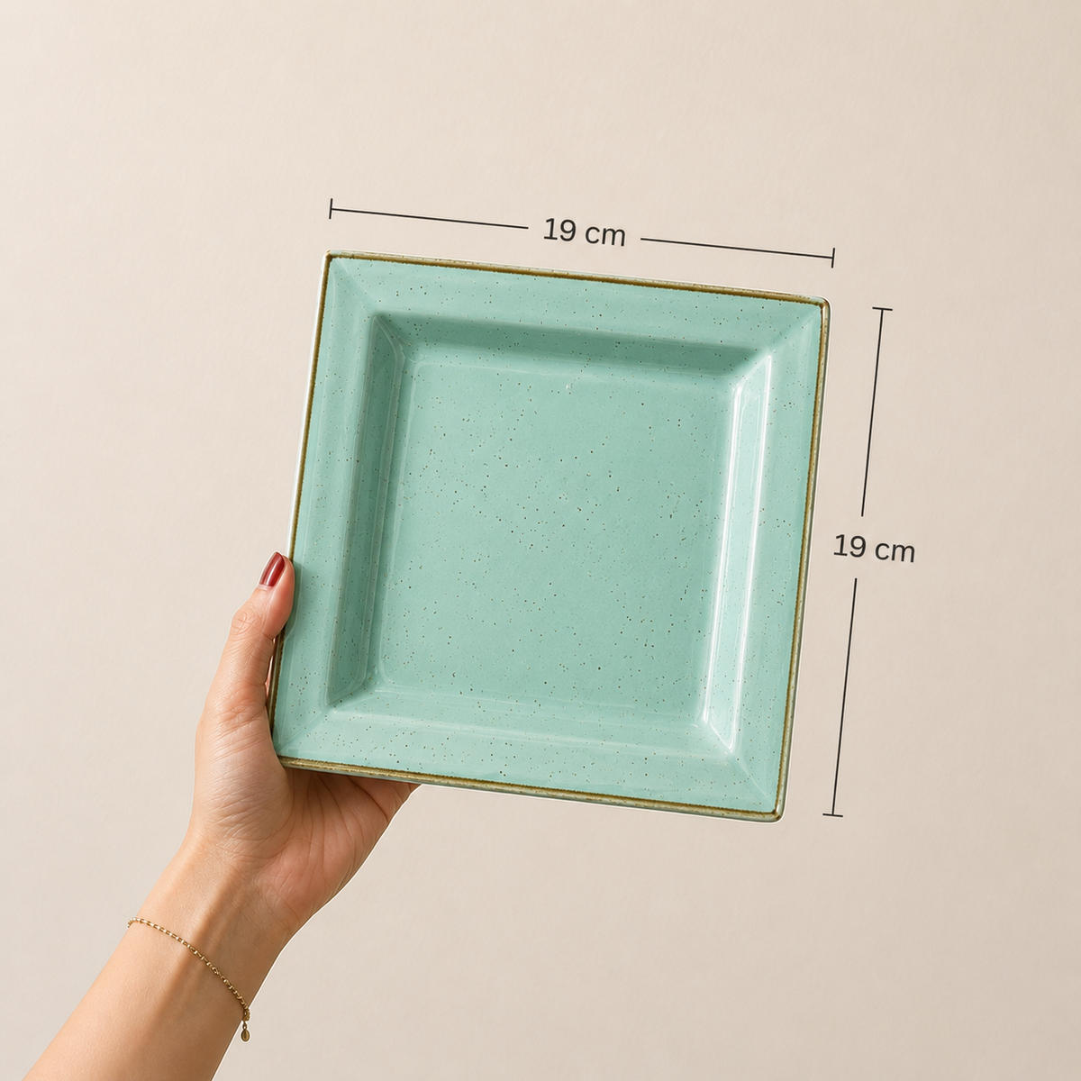 Azula 19 cm square serving platter held in hand with dimensions shown