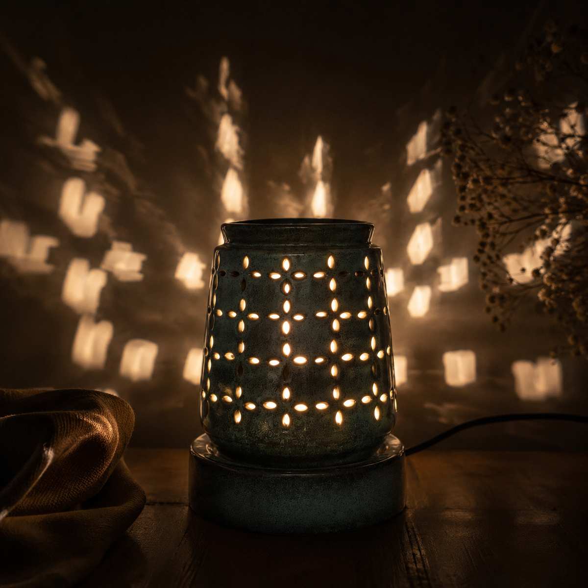 LUXE Aroma Lamp glowing in a dark room with patterned light shadows