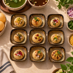 Nine small Nest Petite Servers, served with garnishes and surrounded by bowls of chutney, onions, herbs, and lime on a beige tabletop.
