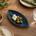 Patra ceramic serving platter with leaf-inspired design and blue glaze by OZAY Living
