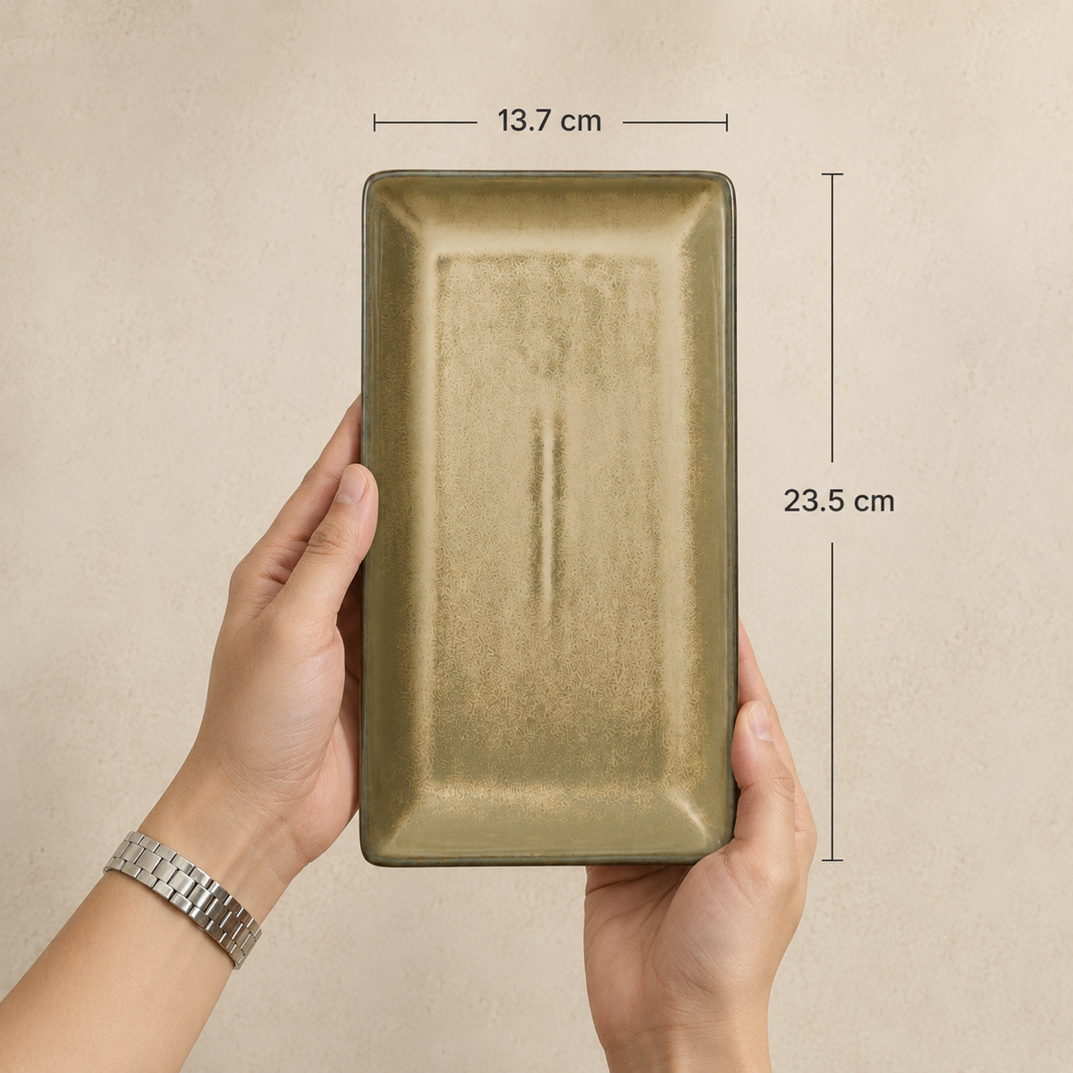 
Sand Stone Serving Platter by OZAY Living shown in hand with dimensions of 23.5 cm length and 13.7 cm width