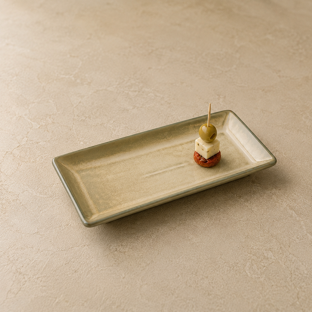 
Sand Stone Serving Platter by OZAY Living styled on a dining table with food, shown from a 45 degree angle
