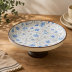 OZAY Living Sapphire floral ceramic serving platter with wooden pedestal base
