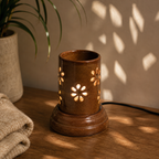 Serene brown ceramic aroma lamp placed on a wooden table in a cozy home setting